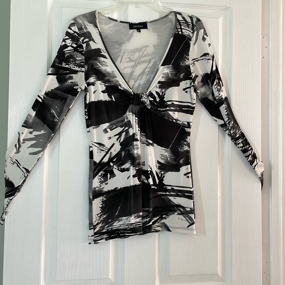Sexy, fun top . Front does show small amount of cleavage
